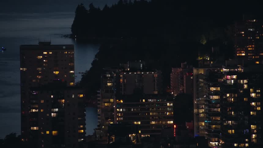 Skyline of skyscraper buildings in a metropolitan area at night