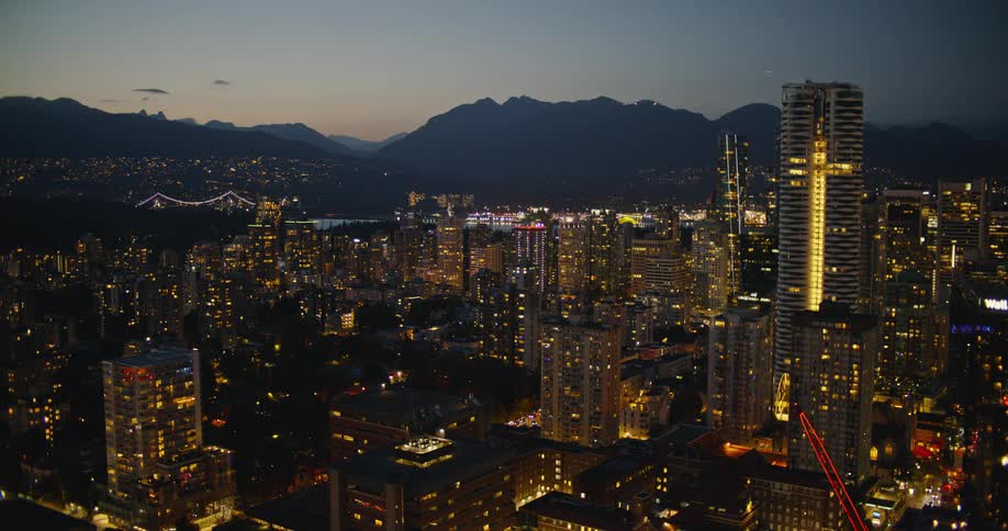 A view of towers in a city at night