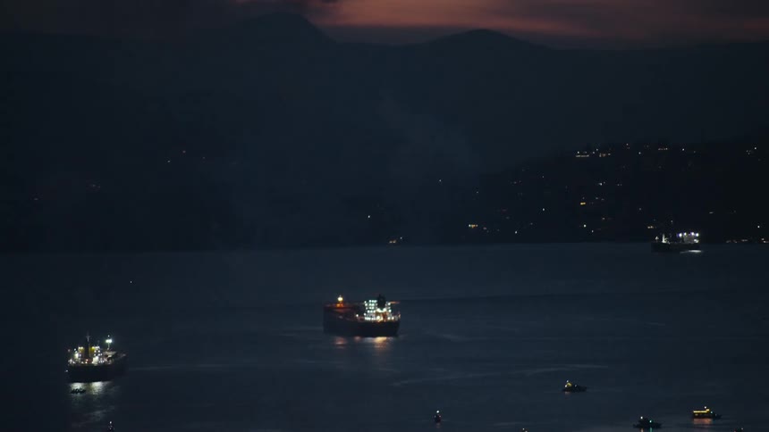 Fireworks leave a trail of smoke as the rise over the water
