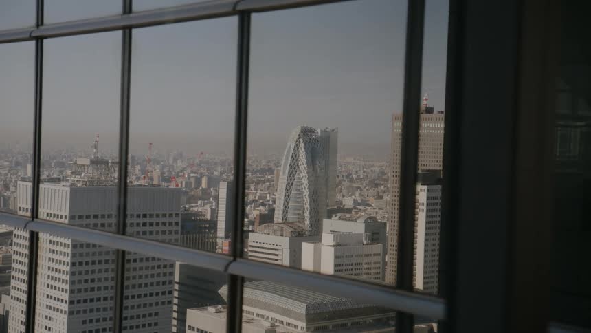 Reflection of a metropolis in the window of a building