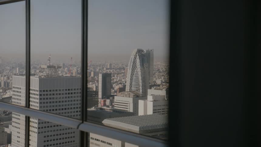 The skyline reflects on the tall tower