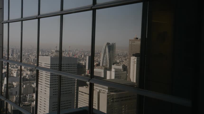 The windows on the tall building are reflective