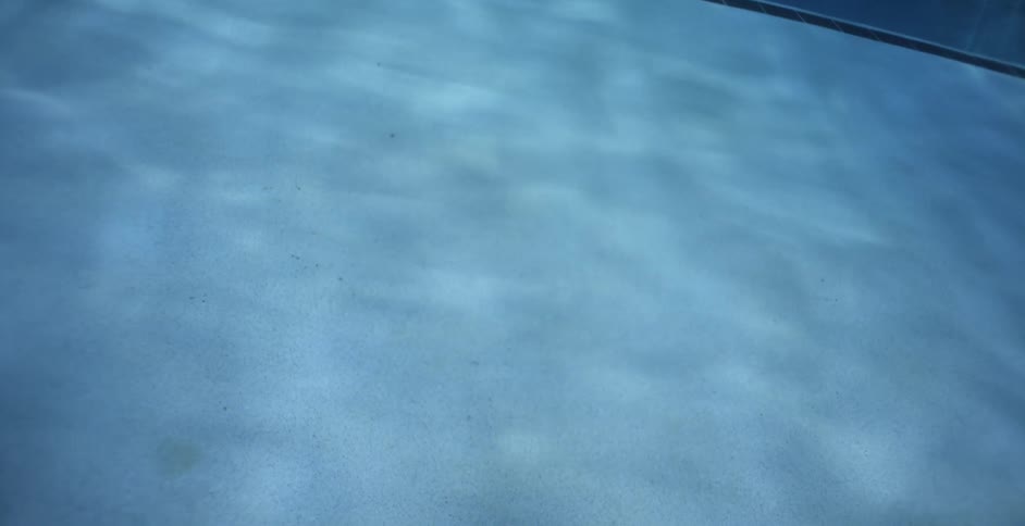 Reflections of water on the bottom of pool