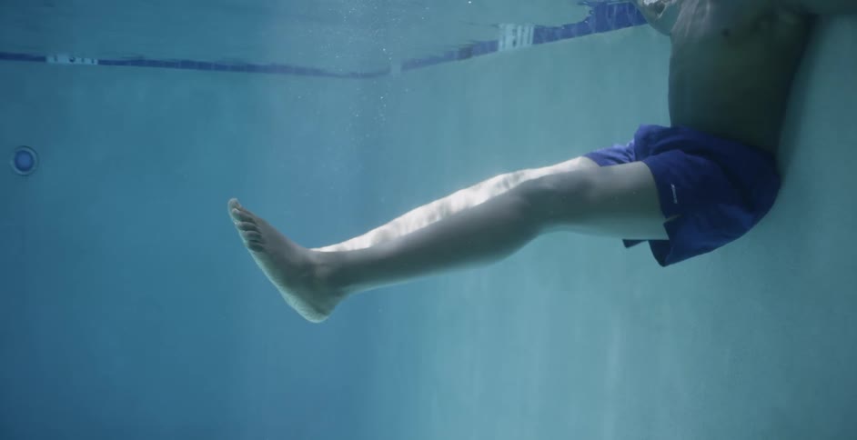 A man is floating in the water