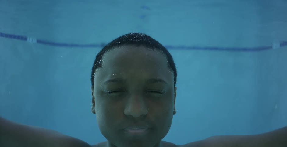 A boy is floating in the water