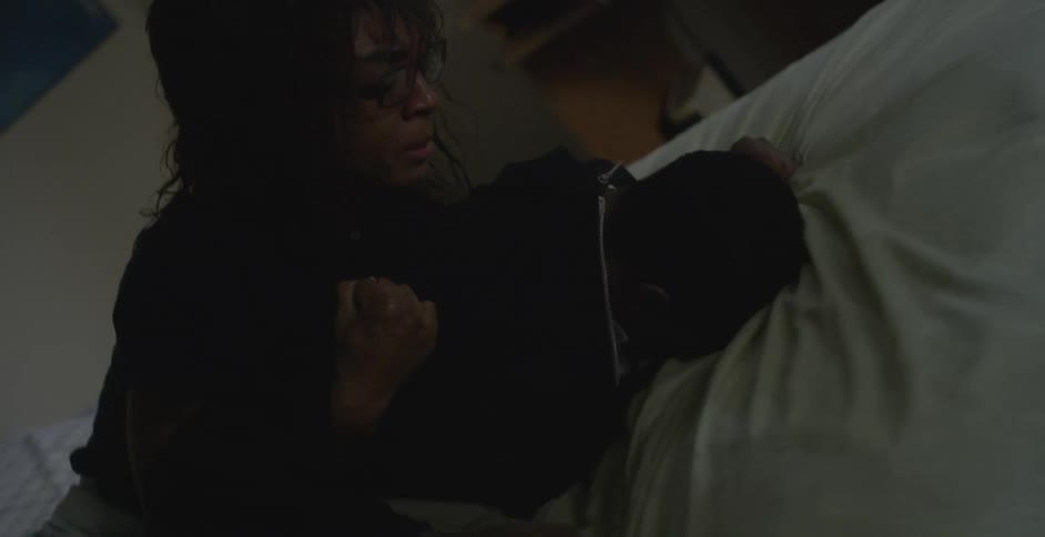 A woman and child fight in the bed