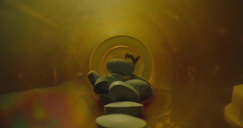 The interior of a pill bottle full of medicine