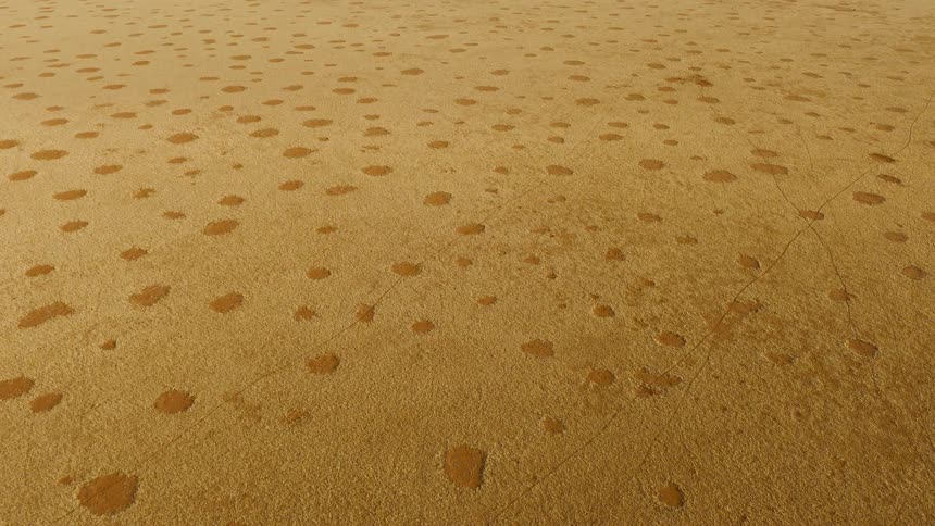 An aerial view of a desert full of sand