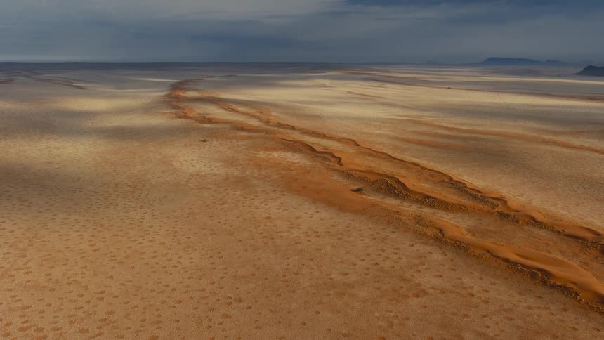An aerial view of the desert on a sunny day