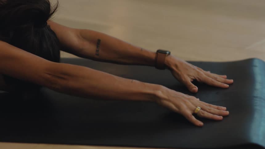 Woman stretching her arms and lengthening her body