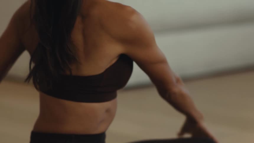 A woman doing stretching in a room