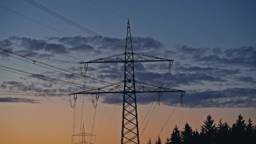 Utility towers with cables stretching across the landscape