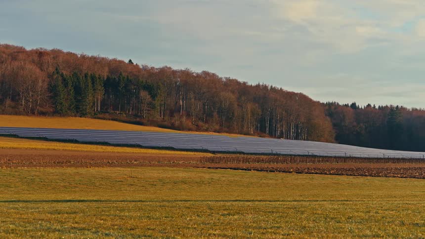 A view of some solar panels out in a field