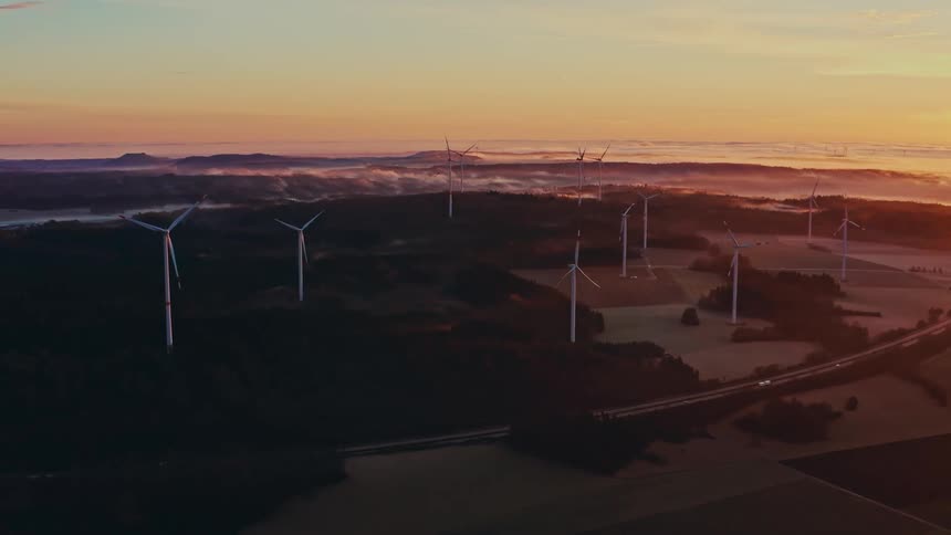 An aerial view of power generating windmills