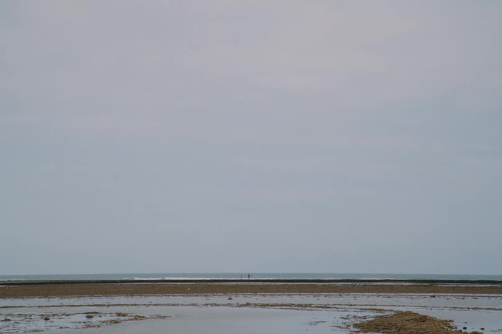 The waves hit the shore line