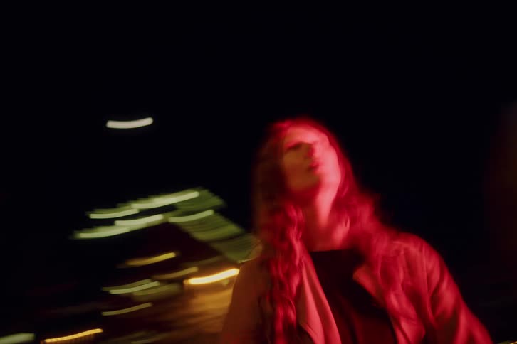 A woman dancing outdoors