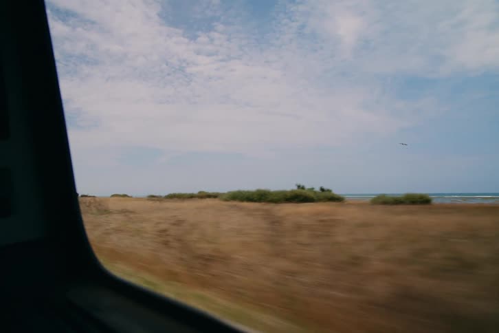 A drive through the countryside along the coastline at midday