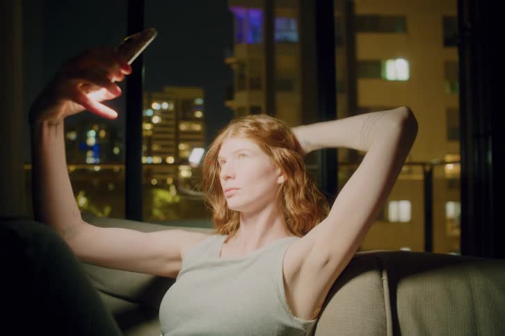 A woman taking a selfie in a room