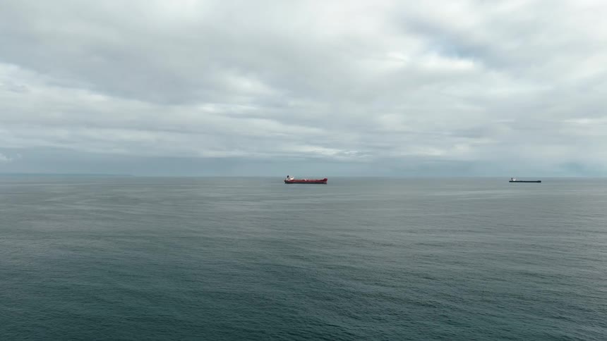Freight ships in the middle of the ocean outdoors during day time