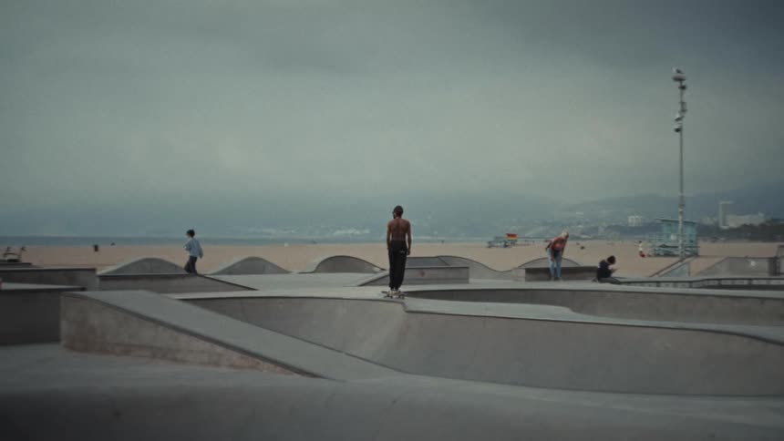 Man skateboarding on a beach skate park