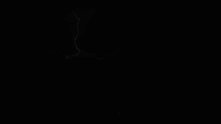 Lightning bolt illuminates a dark sky during a storm
