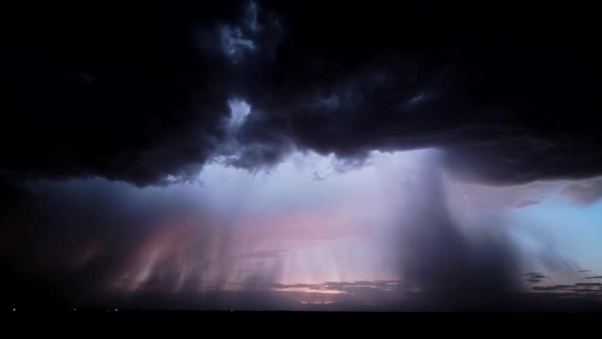 Storm with dense clouds rain shaft and lightning striking the horizon
