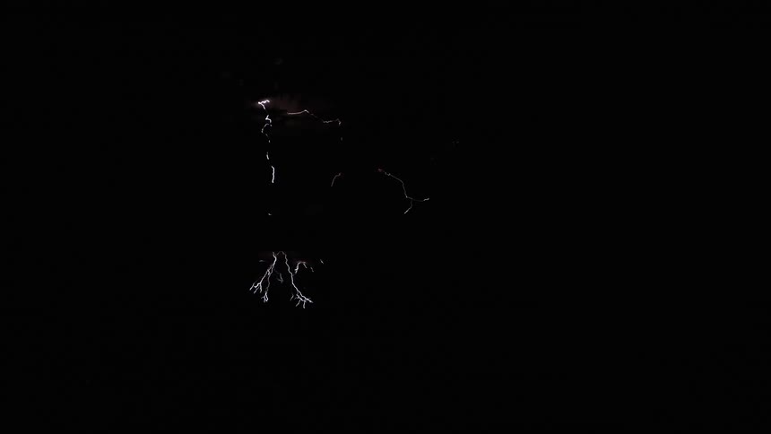 Some lightning striking at night in the dark