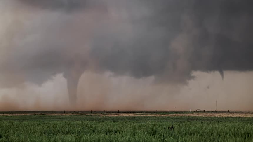An absolutely gorgeous tornado cutting through a field