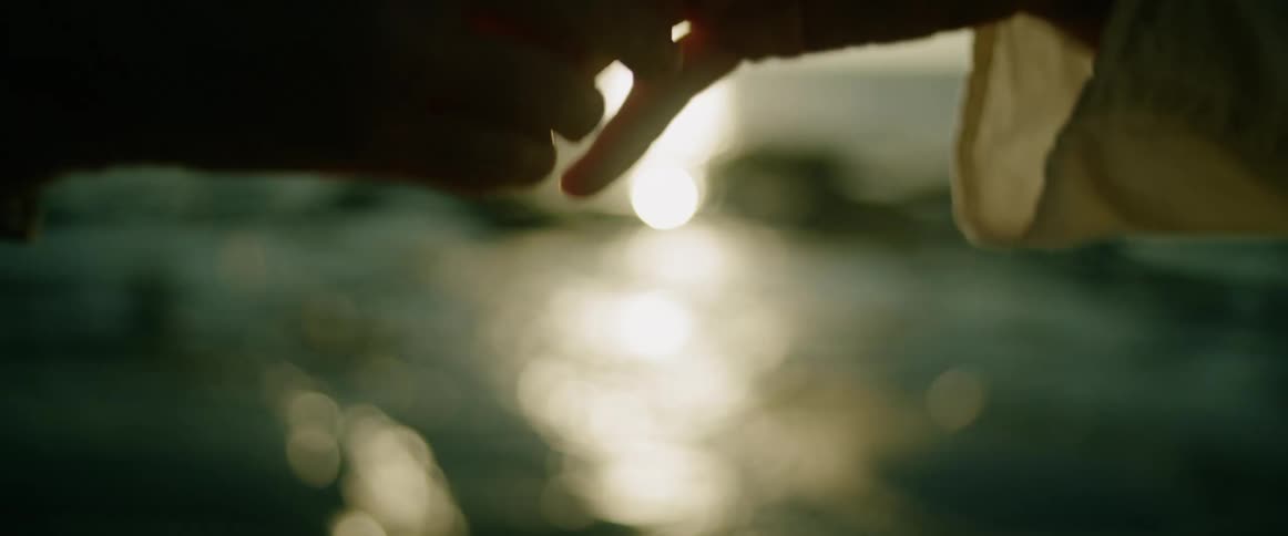 A man and woman holding hands outdoors