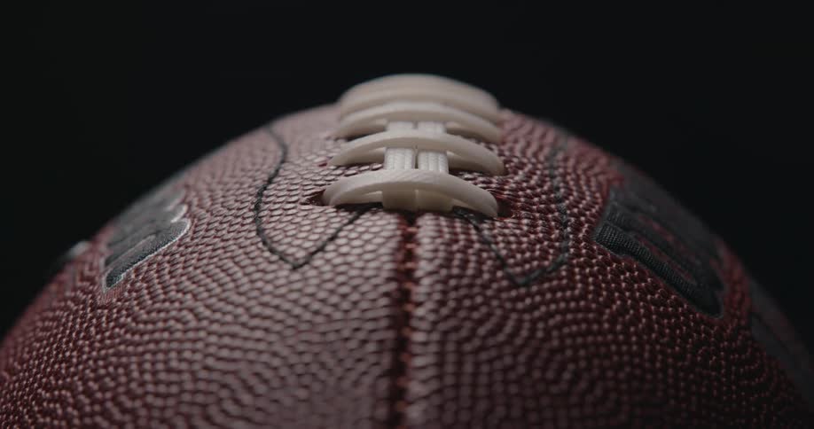 A close up of a football and stitches on it