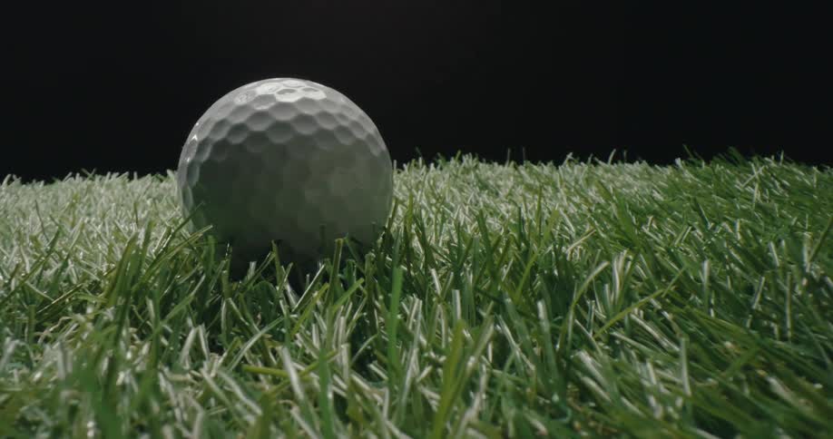 Golf ball bouncing on artificial turf