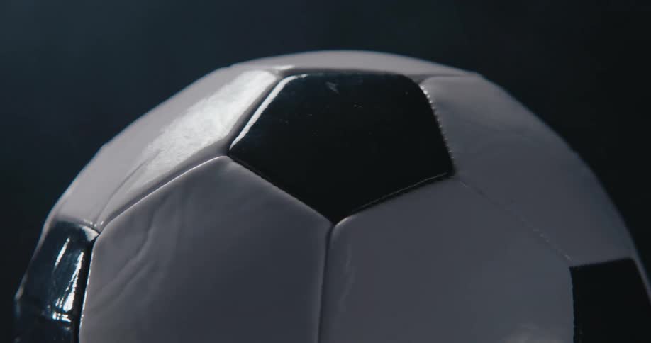 A close up of a soccer ball rotating
