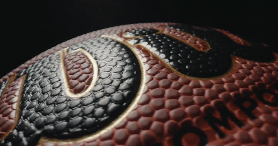 Textured surface of a basketball with embossed pattern and visible channels