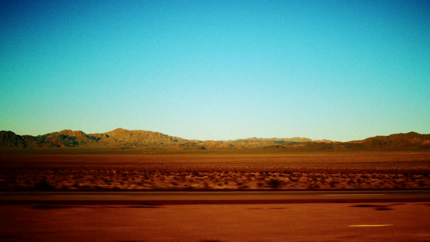 A view of a desert from a car