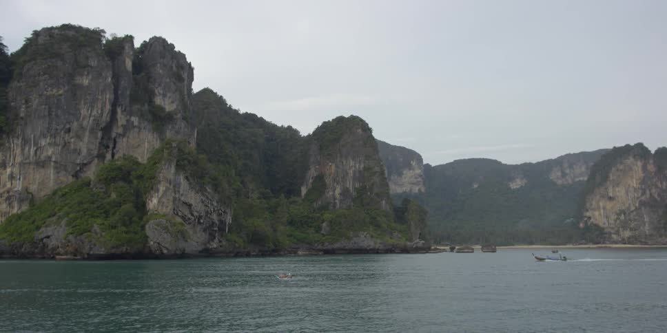 View of large rocky cliffs over a body of water