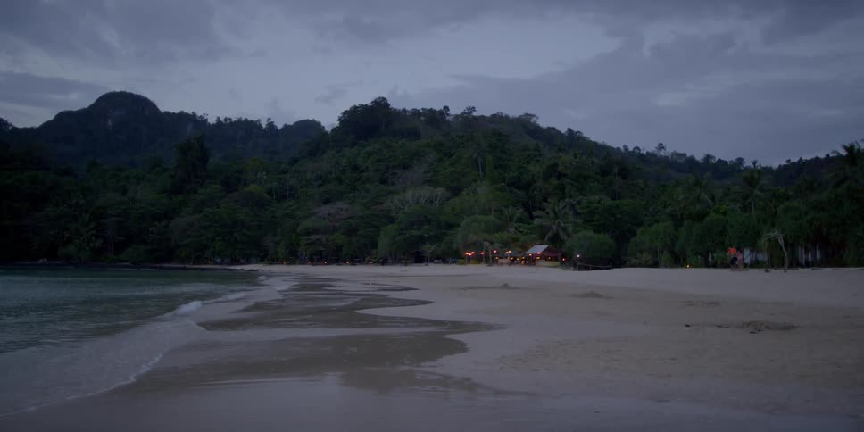 The waves slowly hit the shore of this beach