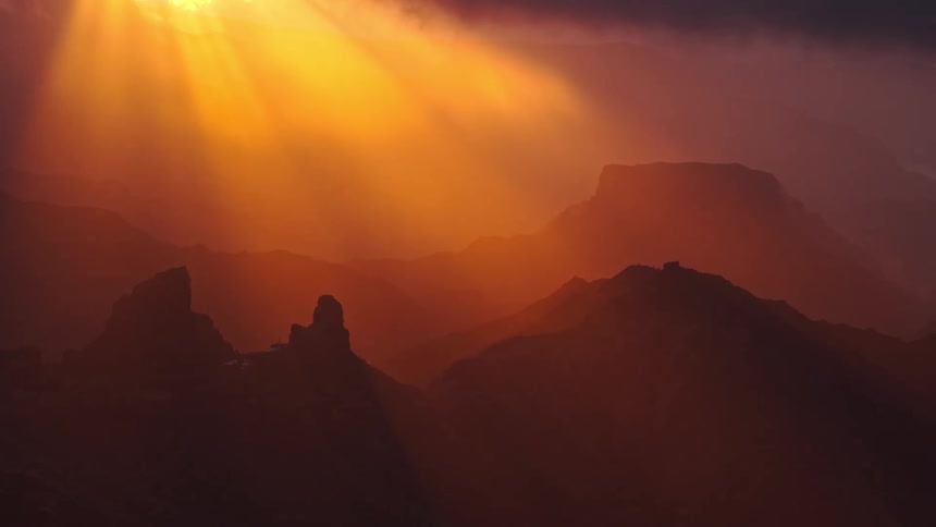 The mountains are in the dark as the sun rise