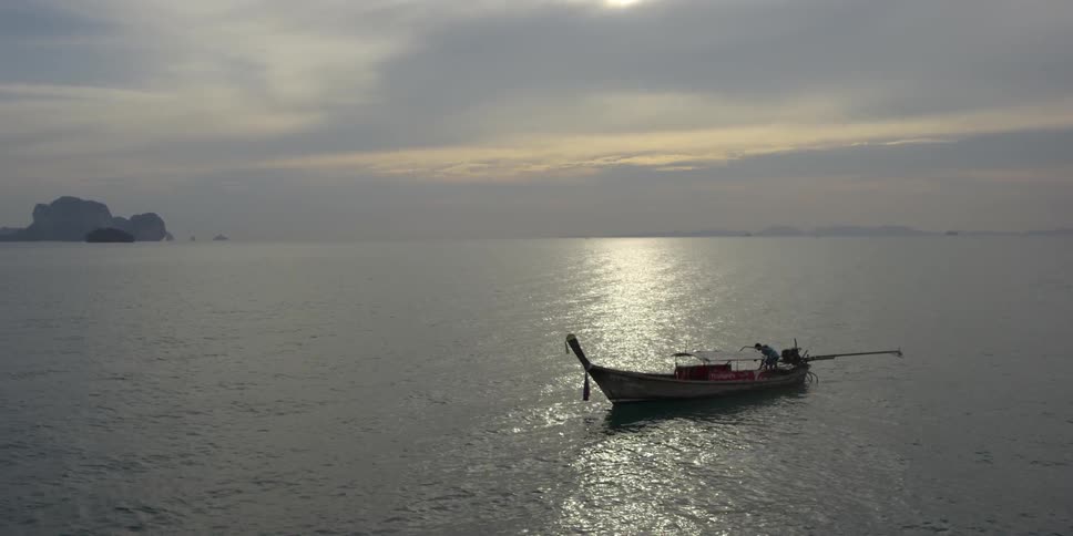 A boat floats on a body of water