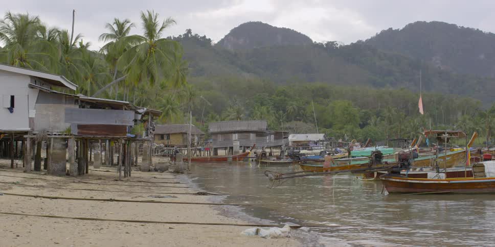 Boats float on water on the coast