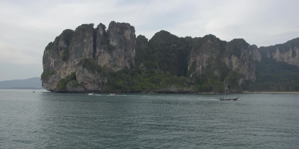 Boats float on a large body of water