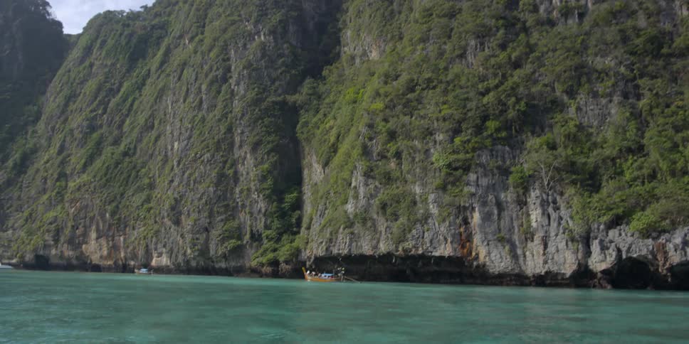 View of a tall cliff next to water
