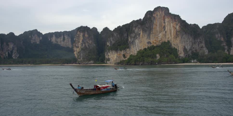 Several boats floating on a river