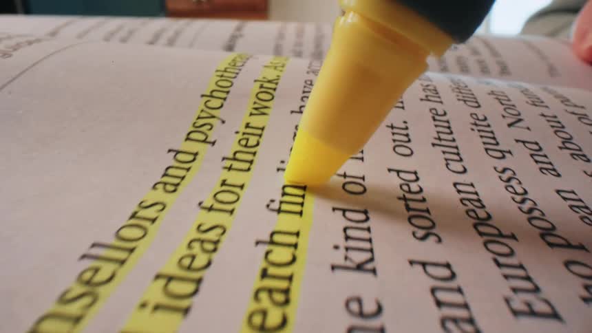 Yellow highlighter underlining a passage from a book