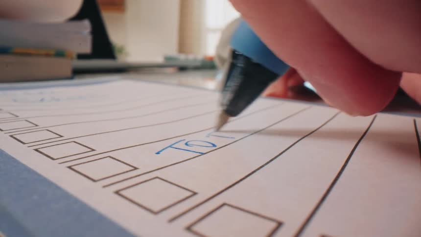 A person writing on paper