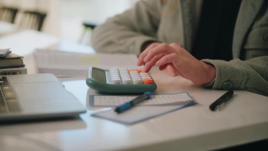 A person typing on a keyboard