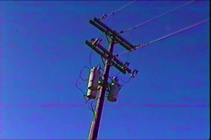Home video of a electric pole as the vintage footage glitches out