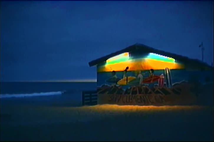 Beachside building lit up with surf mural in san clemente california