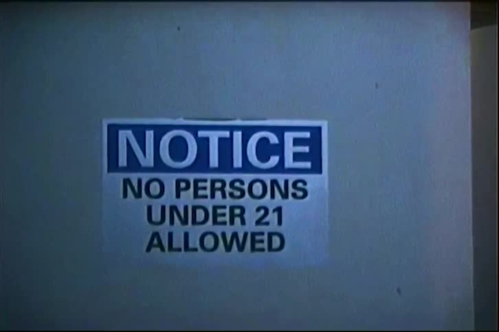 A notice is posted on the side of the building