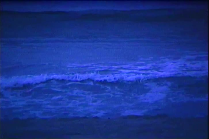 Small waves crash on the sand