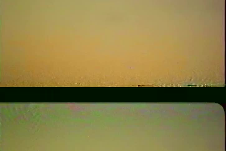 Close up of the surface of a flowing body of water outdoors at night